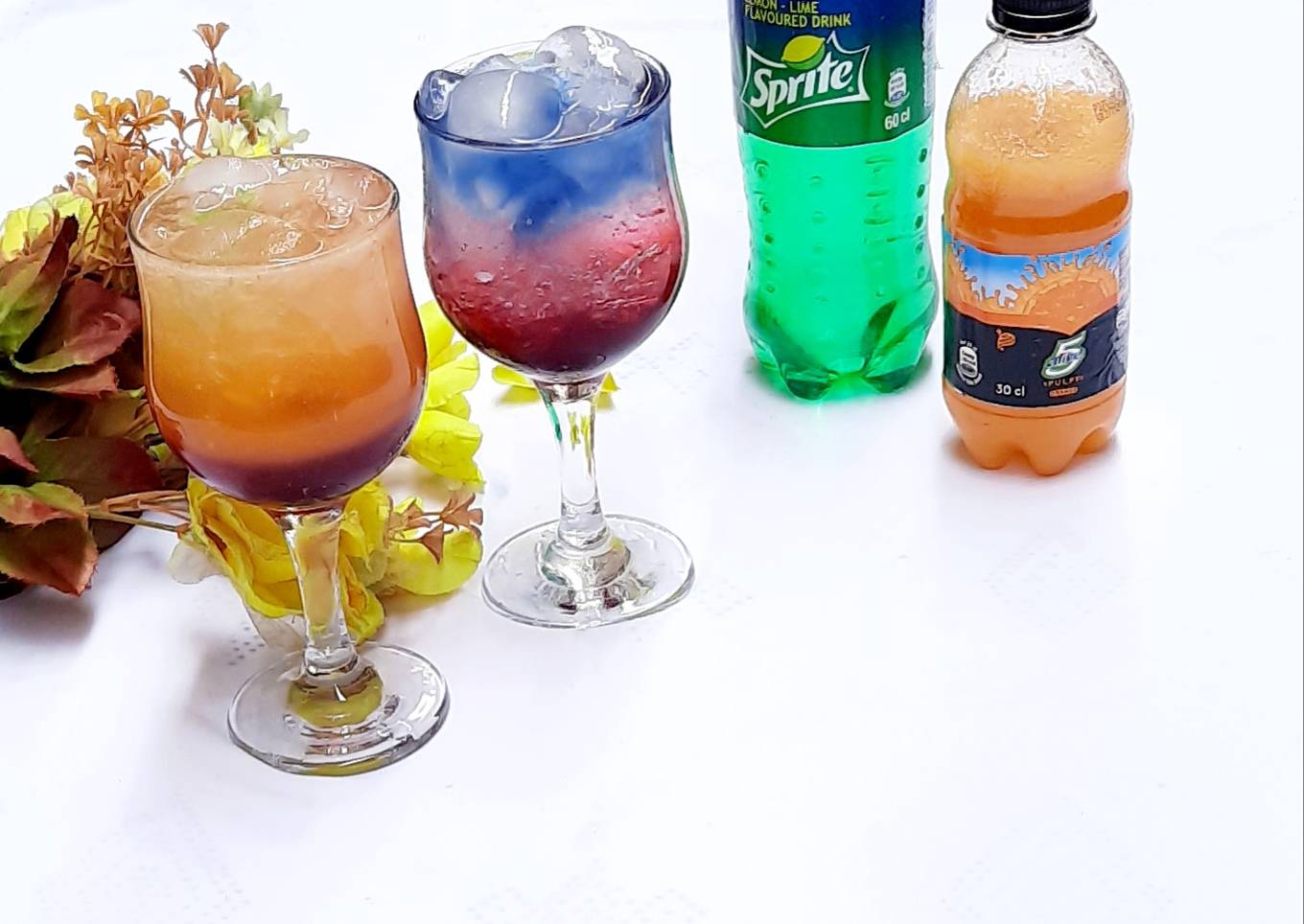 Sunrise and layered blue paradise mocktail