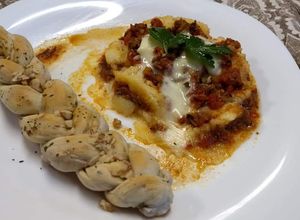 Una foto de Pasticho y focaccia con nuez