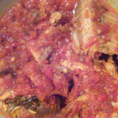 A picture of Palmoil stew and smoked fish.