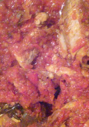 A picture of Palmoil stew and smoked fish.