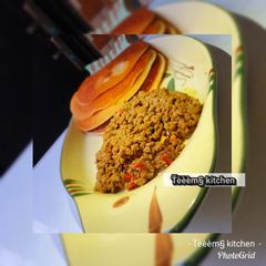 A picture of Pancake with minced meat sauce.