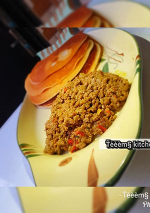 A picture of Pancake with minced meat sauce.