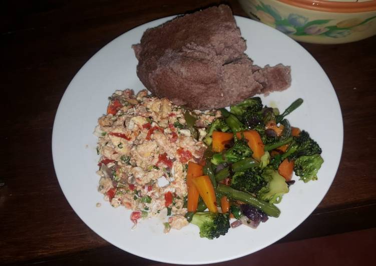 Brown ugali, fried eggs and mixed vegetables