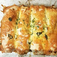 A picture of My Chicken #Enchiladas With Monteray Jack Cheese to Finish 😁.