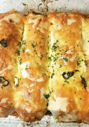A picture of My Chicken #Enchiladas With Monteray Jack Cheese to Finish 😁.