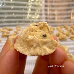 A picture of BUILIR DAL AR CHAALKUMRO BORI (SUN-DRIED Deskinned SPLIT BLACK GRAM & ASH GOURD DUMPLING).