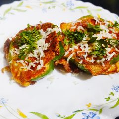 A picture of Cheesy egg stuffed peppers.