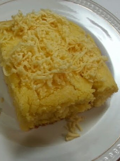 A picture of Corn bread top w/ cheese.