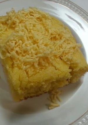 A picture of Corn bread top w/ cheese.