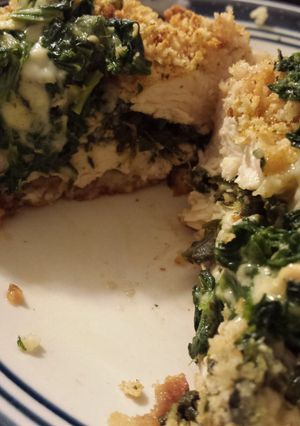 A picture of Stuffed chicken spinach and pepper jack cheese.