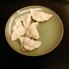 A picture of Homemade pork and mushroom ravioli.