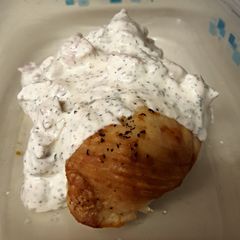 A picture of Baked Chicken Breasts with Creamy Basil Sauce.