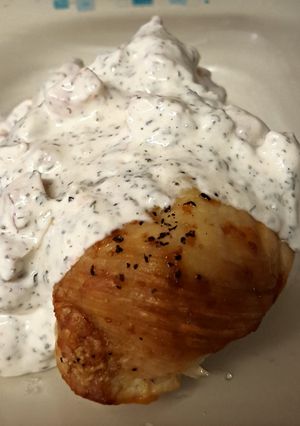 A picture of Baked Chicken Breasts with Creamy Basil Sauce.