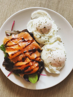 A picture of Salmon and poached eggs.