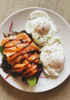 A picture of Salmon and poached eggs.