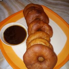 A picture of Doughnut with chocolate sauce.