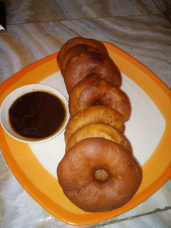 A picture of Doughnut with chocolate sauce.