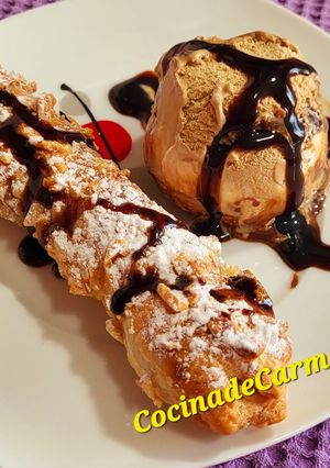 Una foto de Rollitos de hojaldre rellenos de dulce de membrillo, almendras y leche condensada