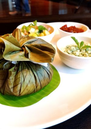 A picture of Malabar style spice potli mussels biriyani(kizhi biriyani).