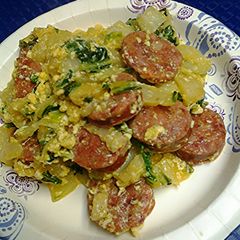 A picture of Smoked sausage with bok choy( Chinese cabbage).