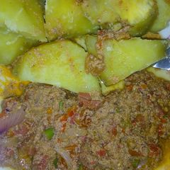 A picture of Potato and egg sauce.