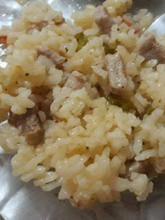 Una foto de Arroz con lomo a mi gusto