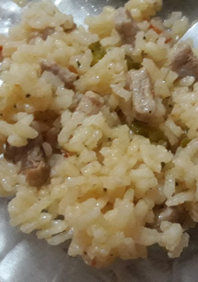 Una foto de Arroz con lomo a mi gusto