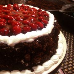 A picture of Cherry-full Blackforest Cake.