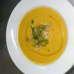 A picture of Creamy gingered Kumara (sweet potato) soup with toasted coconut.
