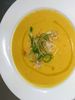 A picture of Creamy gingered Kumara (sweet potato) soup with toasted coconut.
