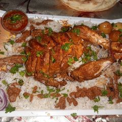 A picture of Desi Murgh musalam with rice platter😋😋😋😋.