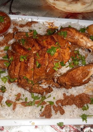 A picture of Desi Murgh musalam with rice platter😋😋😋😋.