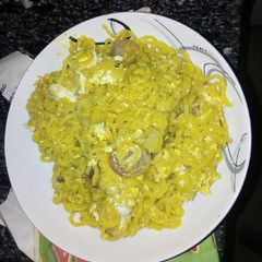 A picture of Indomie noodles with egg.
