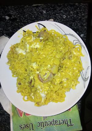 A picture of Indomie noodles with egg.