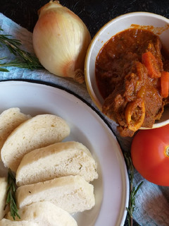A picture of Beef Curry and Bamboo Steamer Dumplings.