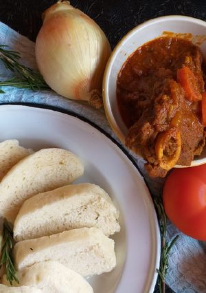 A picture of Beef Curry and Bamboo Steamer Dumplings.