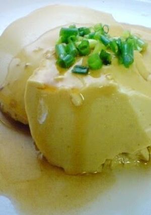 A picture of Egg Tofu with Soy Milk In a Bowl.