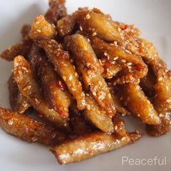 A picture of ［Vegetarian] Fried Burdock Root with Sweet-Salty Sauce and Sesame Seeds.