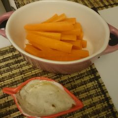 A picture of Carrots with honey yogurt dip.