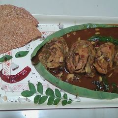 A picture of ChamaDumpa Aaku Swiss Roll pulusu (Yam leaves Swiss Roll pulusu).
