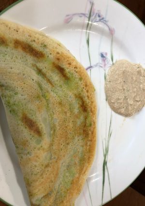 A picture of Dosa or rice crepe with mashed potato & avacado.
