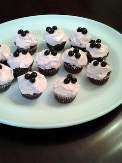 A picture of Chocolate Cupcakes with Pomegranate Cream Cheese Frosting.
