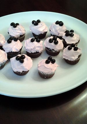 A picture of Chocolate Cupcakes with Pomegranate Cream Cheese Frosting.