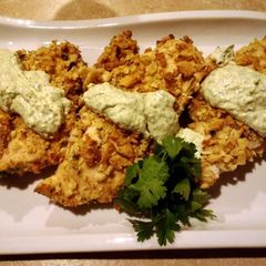 A picture of Baked chicken, crispy style with green goddess dressing.