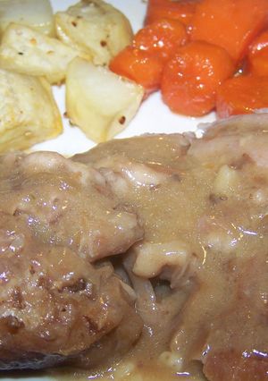 A picture of Pork Pot Roast Roasted Potatoes & Candied Carrots.