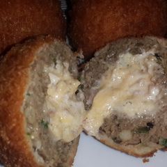 A picture of Double Cheese and Bacon Centered, Crumbed Meatballs.