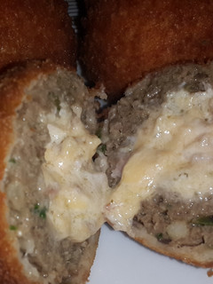 A picture of Double Cheese and Bacon Centered, Crumbed Meatballs.