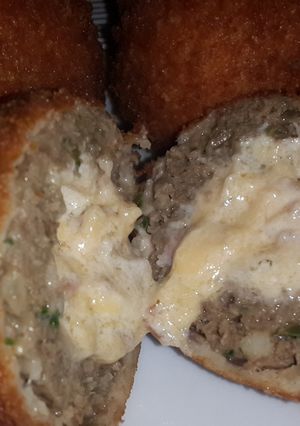 A picture of Double Cheese and Bacon Centered, Crumbed Meatballs.
