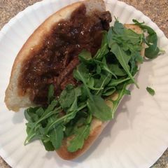 A picture of Flank Steak In Sauce On Hoagie.