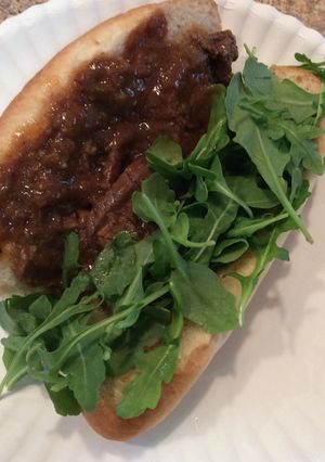 A picture of Flank Steak In Sauce On Hoagie.
